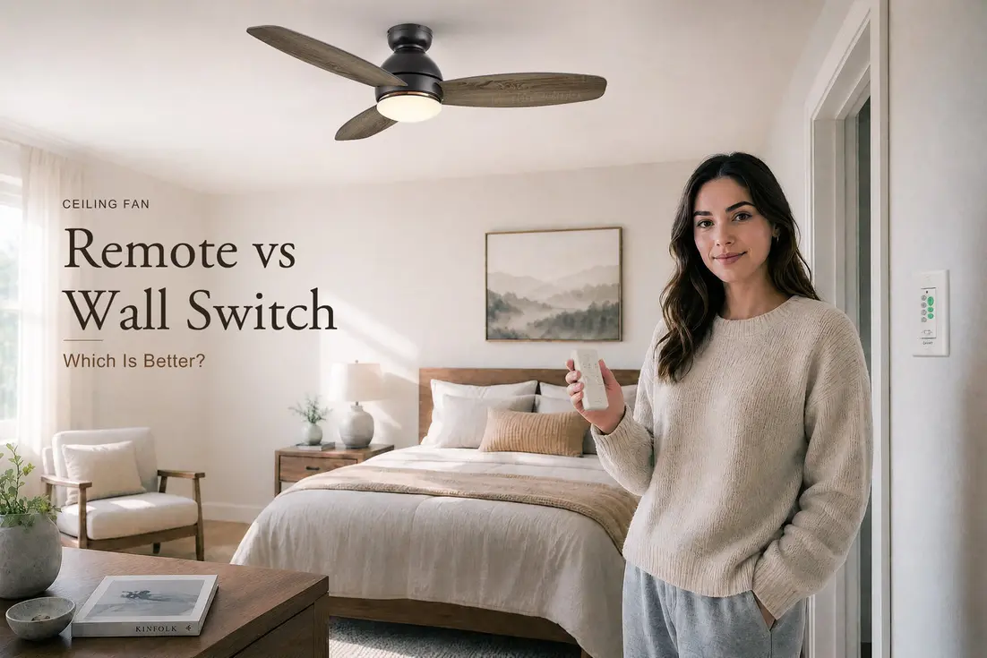 A woman stands in a well-decorated bedroom holding a remote, next to a ceiling fan and wall switch.