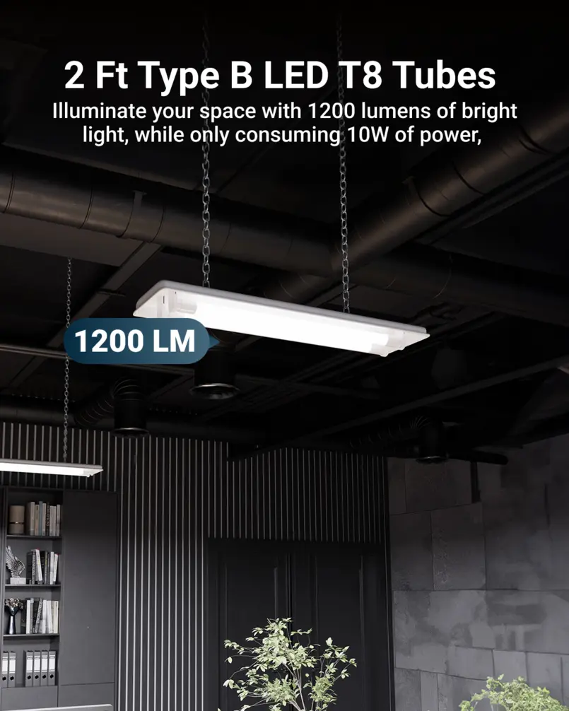 Two-foot LED ceiling fixture with modern design, suspended by chains in a dark interior space.