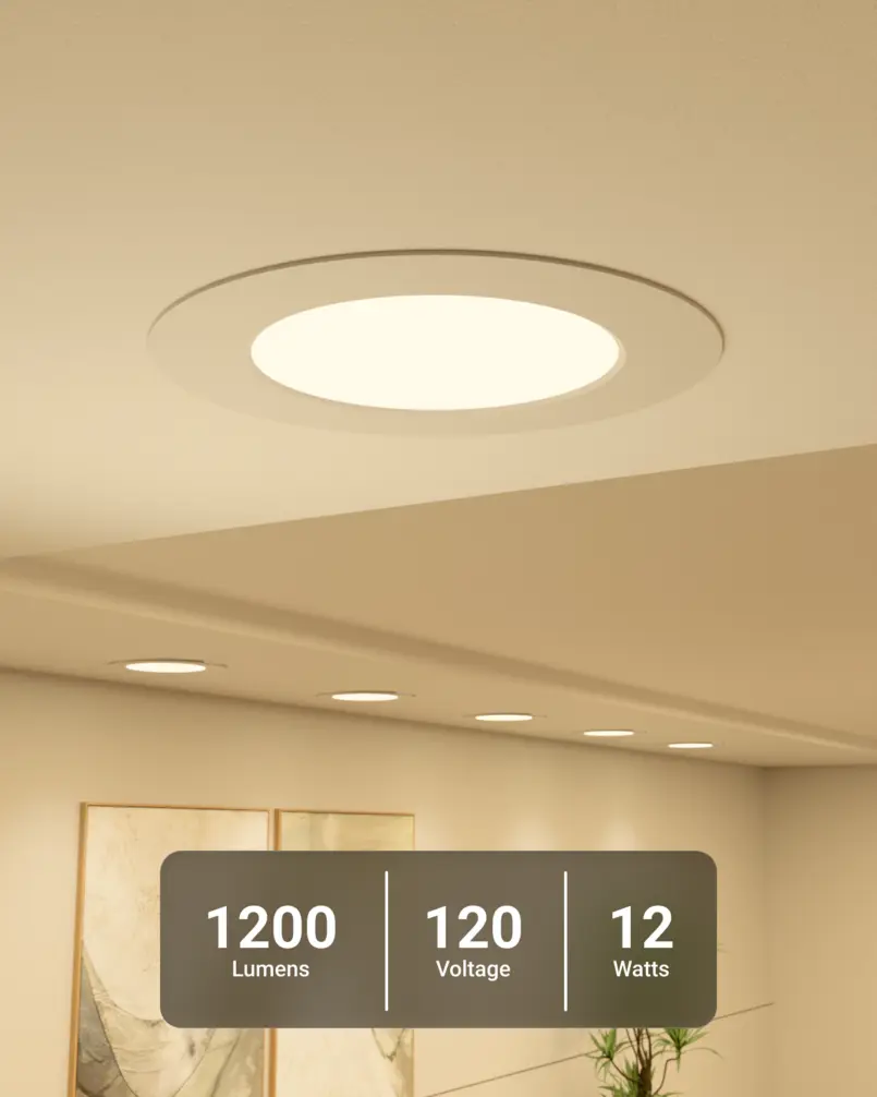 Recessed LED lights installed in a ceiling, illuminating a room with a warm glow.